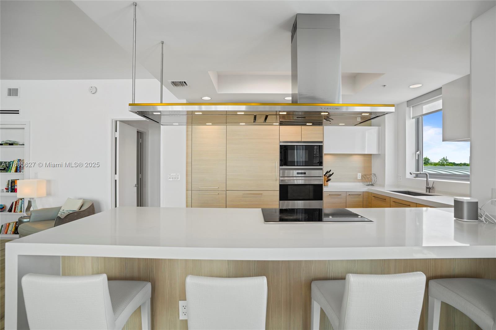 17111 Biscayne Boulevard, Unit 401 North Miami Beach, FL 33160 - Photo 13 of 66 a kitchen with stainless steel appliances a sink and a refrigerator