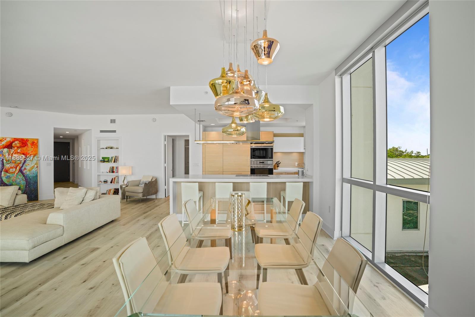 17111 Biscayne Boulevard, Unit 401 North Miami Beach, FL 33160 - Photo 16 of 66 a dining room with furniture and chandelier