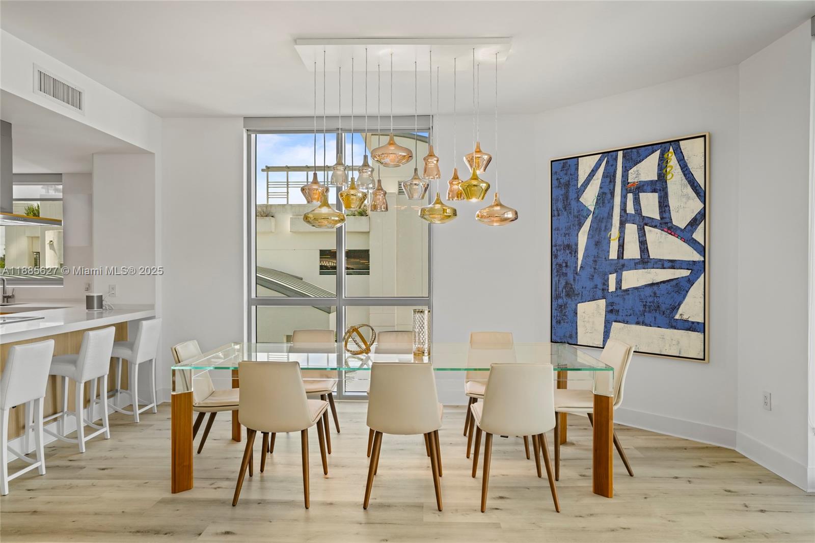 17111 Biscayne Boulevard, Unit 401 North Miami Beach, FL 33160 - Photo 18 of 66 a view of a dining room with furniture and wooden floor