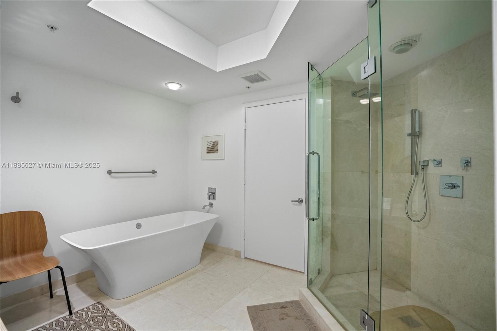 17111 Biscayne Boulevard, Unit 401 North Miami Beach, FL 33160 - Photo 27 of 66 a bathroom with a bathtub and shower