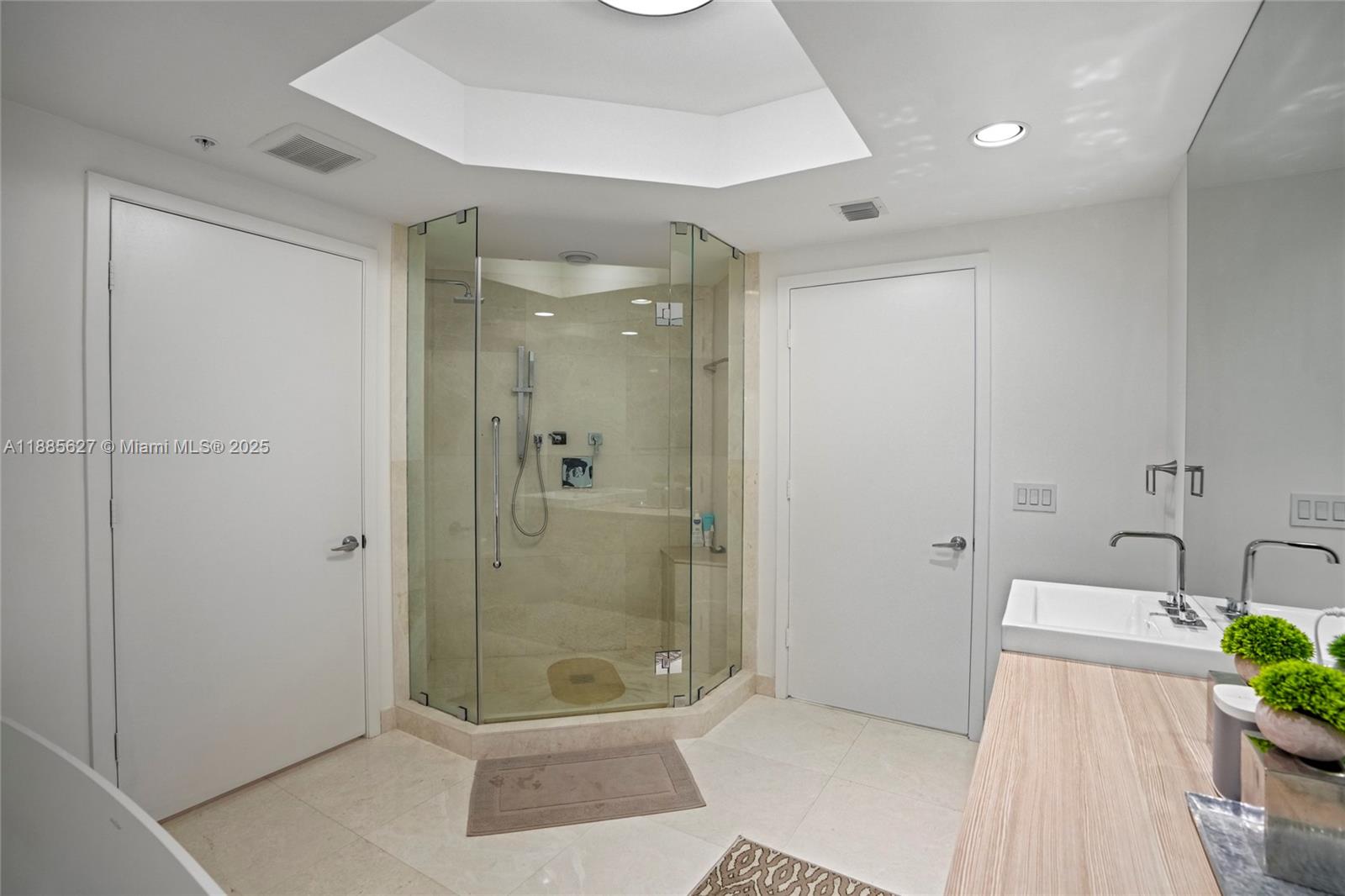 17111 Biscayne Boulevard, Unit 401 North Miami Beach, FL 33160 - Photo 29 of 66 a bathroom with a shower and a toilet