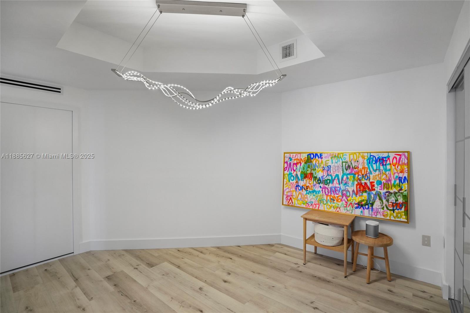 17111 Biscayne Boulevard, Unit 401 North Miami Beach, FL 33160 - Photo 35 of 66 a workspace with furniture and wooden floor