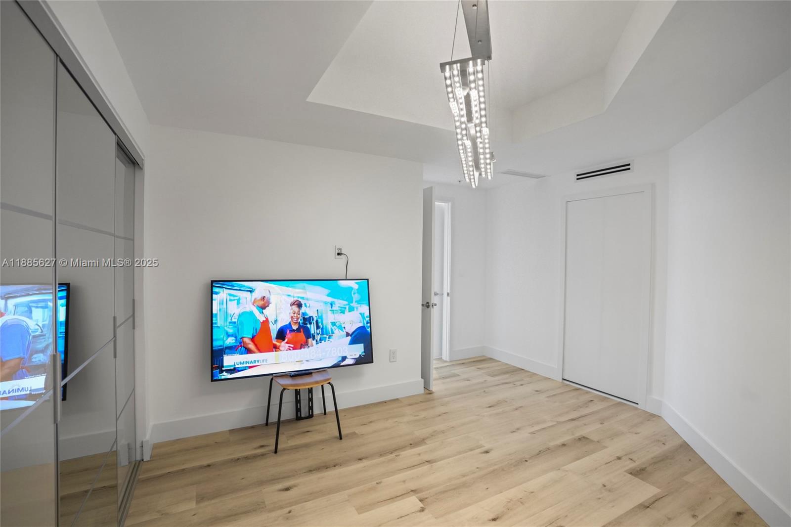 17111 Biscayne Boulevard, Unit 401 North Miami Beach, FL 33160 - Photo 36 of 66 a view of a room with furniture wooden floor and window