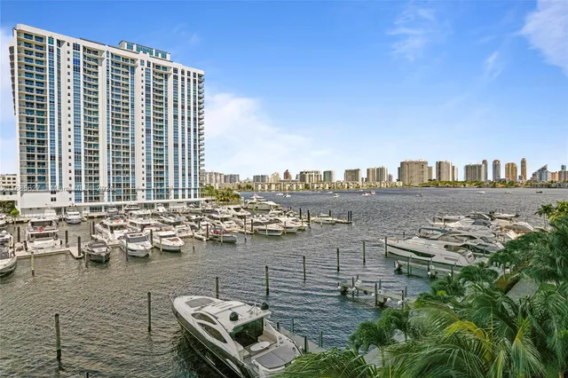 an aerial view of a house with a yard lake view and mountain view