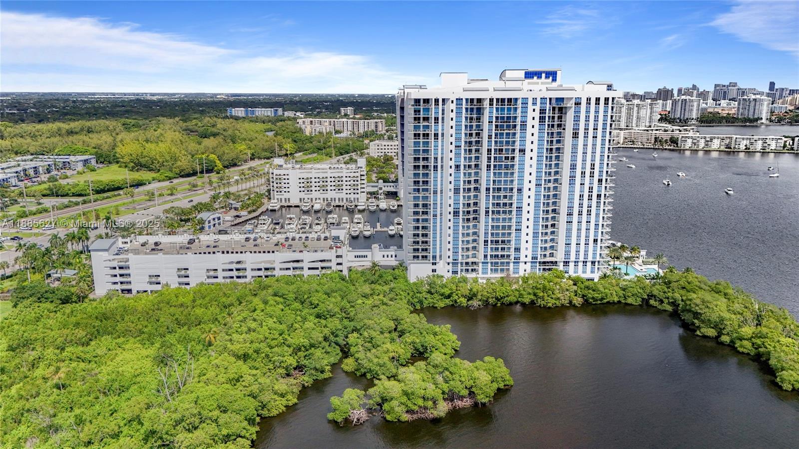 17111 Biscayne Boulevard, Unit 401 North Miami Beach, FL 33160 - Photo 50 of 66 a view of a lake with a building in the background