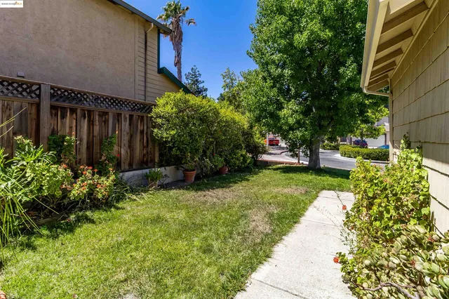 a view of yard with patio