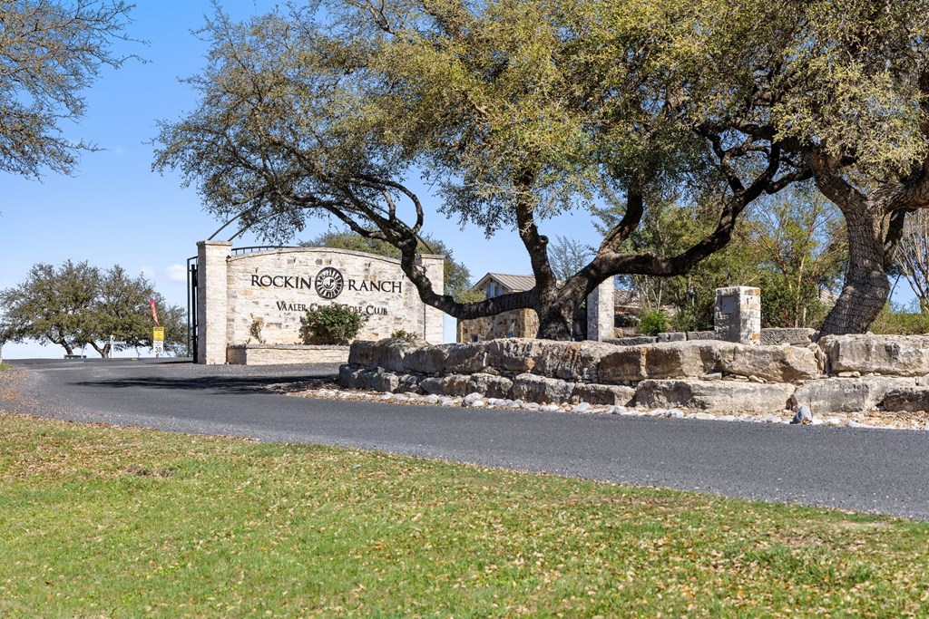 207 North Calvin Barrett, Unit 220 Blanco, TX 78606 - Photo 2 of 18 a view of a house with a yard and sitting area