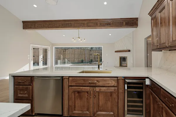 a kitchen with stainless steel appliances granite countertop a stove and a sink