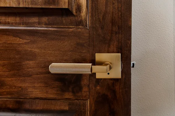 a bathroom with double vanity and a large mirror