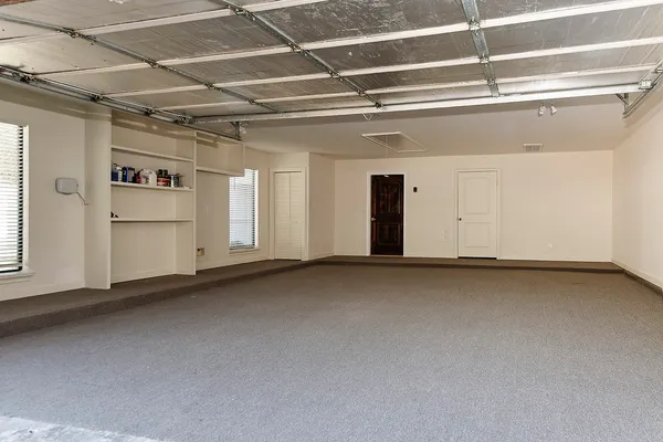 an aerial view of a house with outdoor space