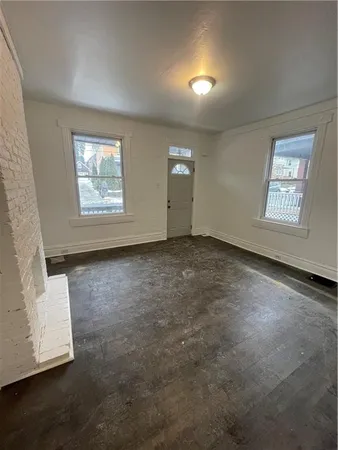 an empty room with windows