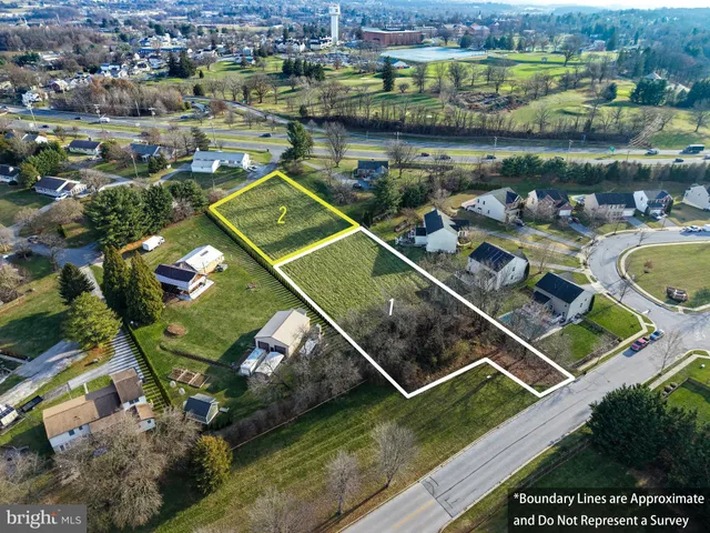 an aerial view of a house with a lake view