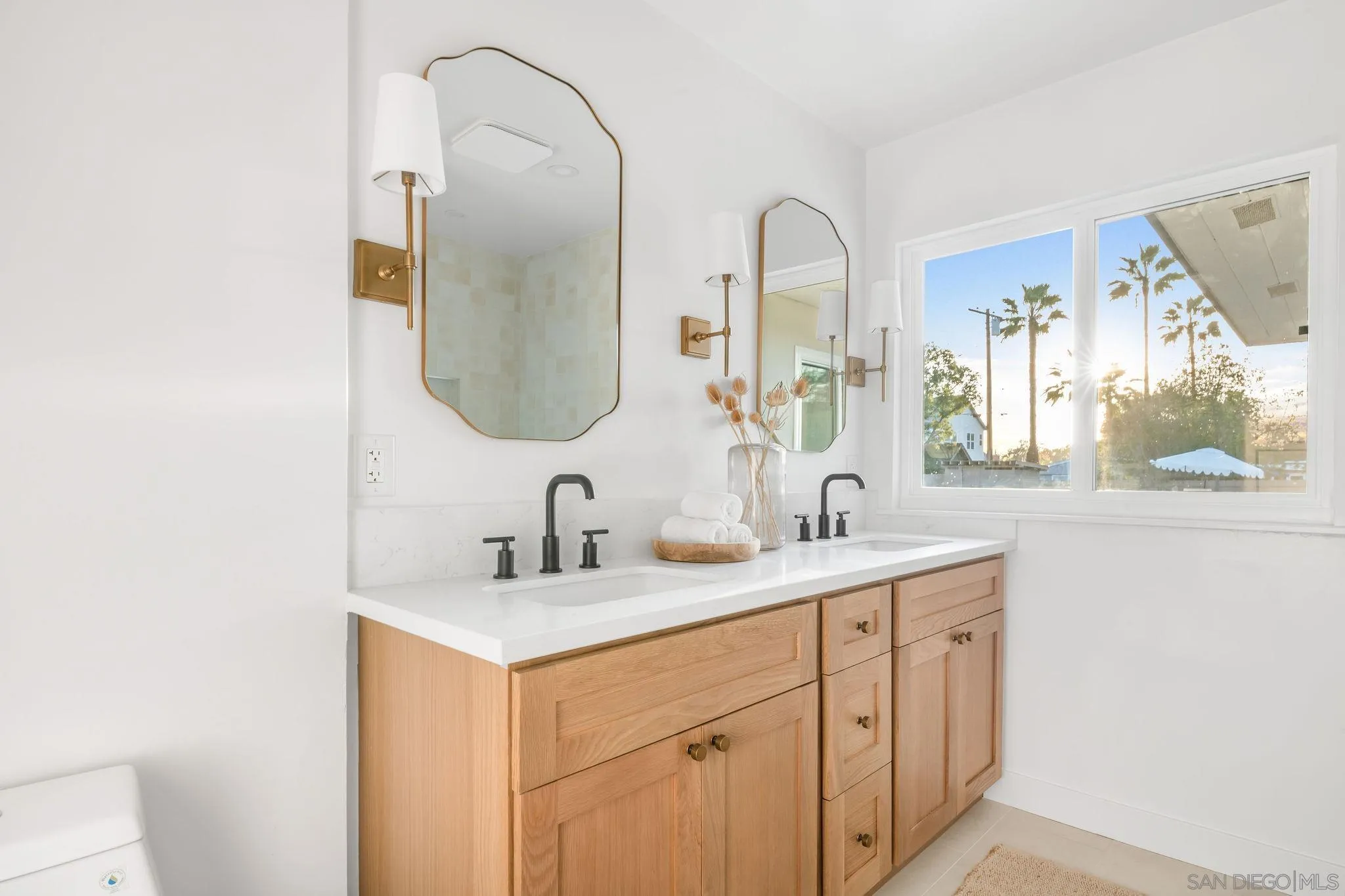 486 Murray Drive El Cajon, CA 92020 - Photo 14 of 22 a bathroom with a double vanity sink and a mirror