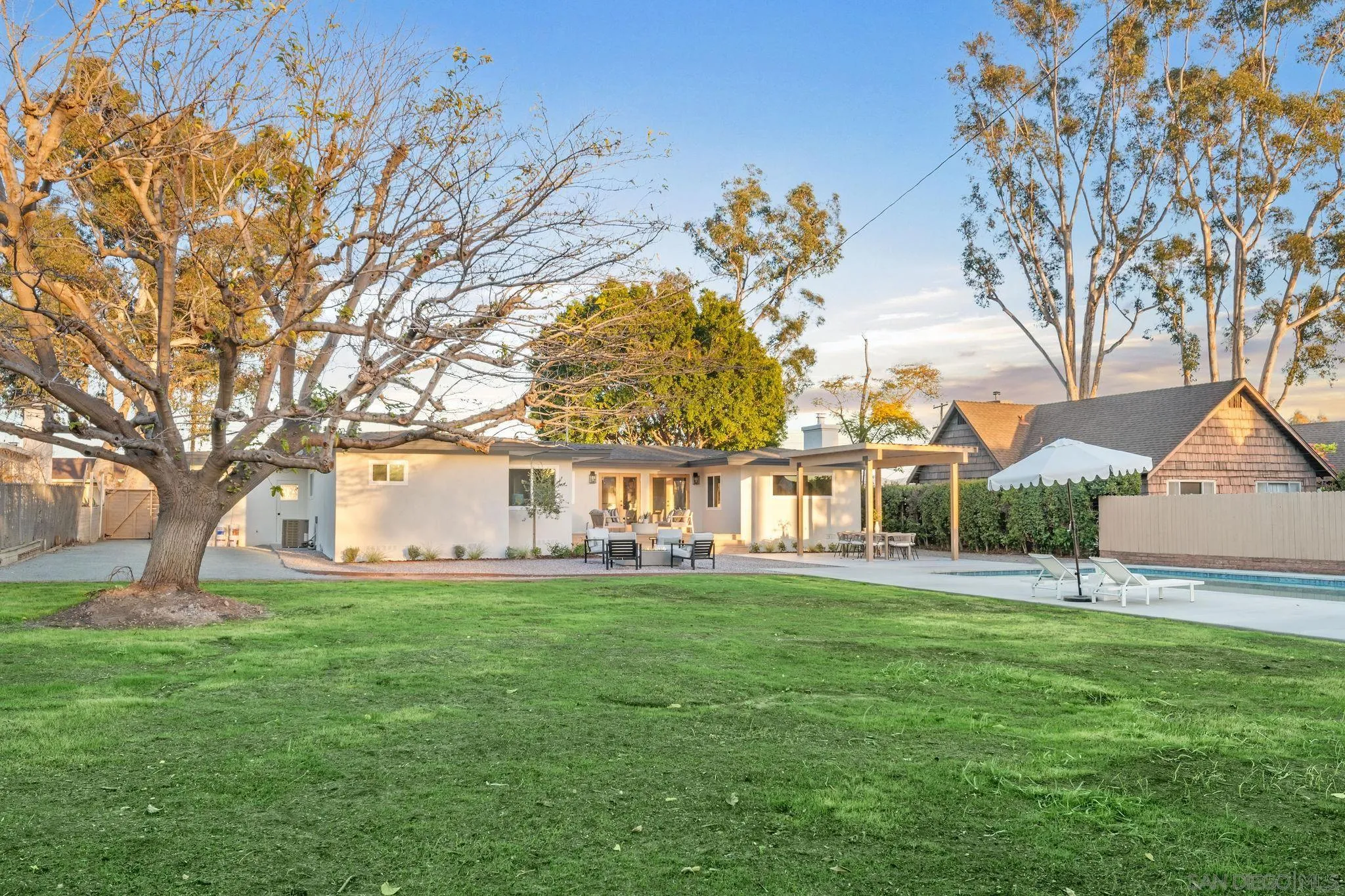 486 Murray Drive El Cajon, CA 92020 - Photo 20 of 22 a front view of a house with a garden and trees