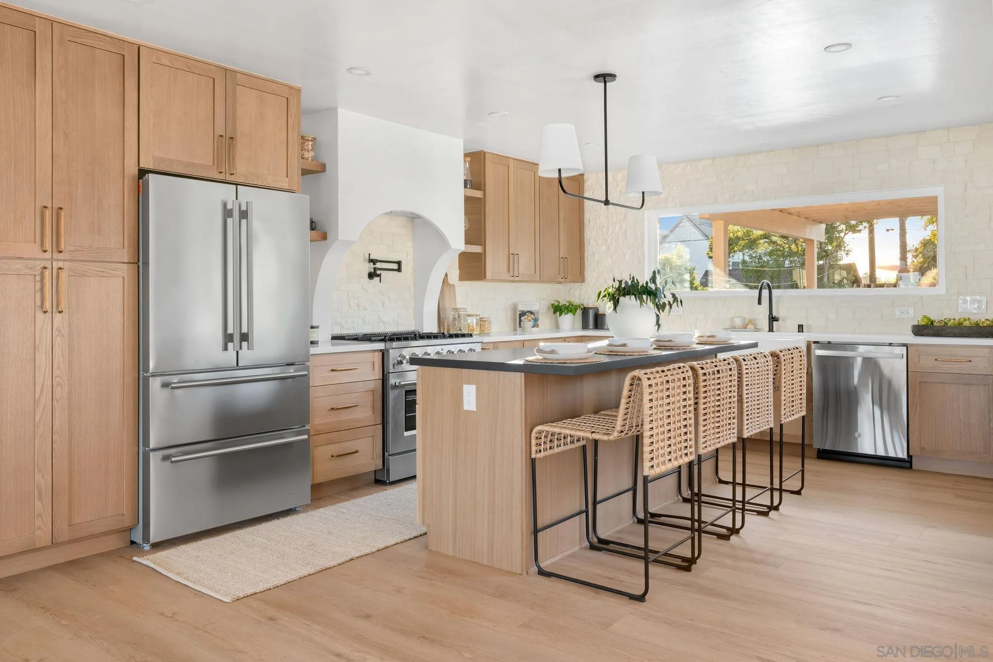 486 Murray Drive El Cajon, CA 92020 - Photo 6 of 22 a kitchen with stainless steel appliances a stove a sink and a refrigerator