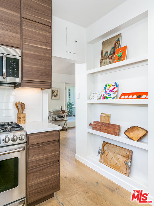 2386 Allen Avenue Altadena, CA 91001 - Photo 11 of 41 a kitchen with a stove and cabinets