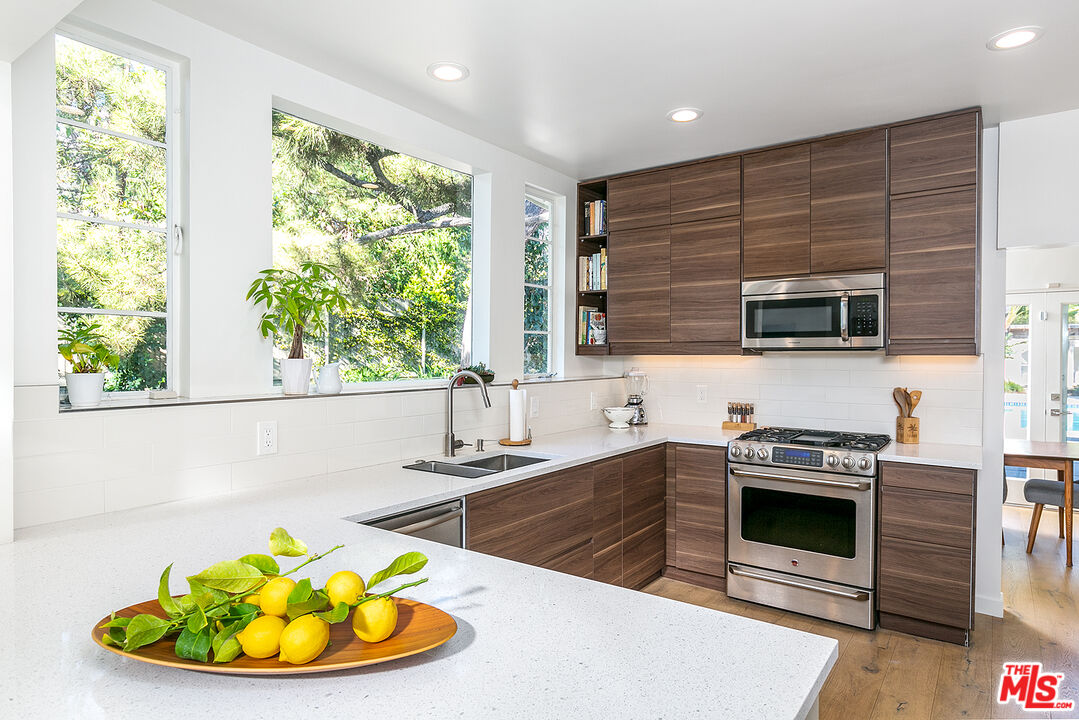 2386 Allen Avenue Altadena, CA 91001 - Photo 13 of 41 a kitchen with a stove a sink and a microwave