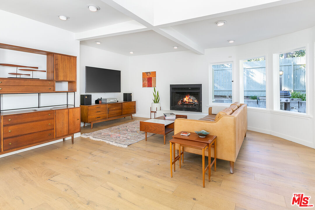 2386 Allen Avenue Altadena, CA 91001 - Photo 15 of 41 a living room with furniture flat screen tv and a fireplace