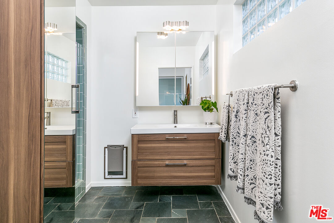 2386 Allen Avenue Altadena, CA 91001 - Photo 22 of 41 a bathroom with a sink and a mirror