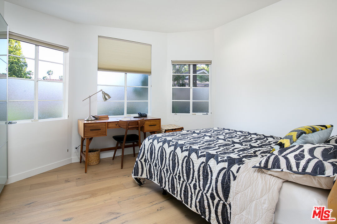 2386 Allen Avenue Altadena, CA 91001 - Photo 24 of 41 a bed sitting in a bedroom next to a window
