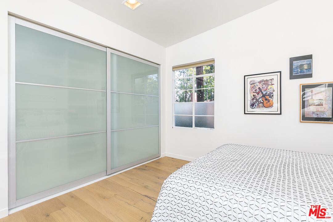 2386 Allen Avenue Altadena, CA 91001 - Photo 28 of 41 a bedroom with a bed and a window