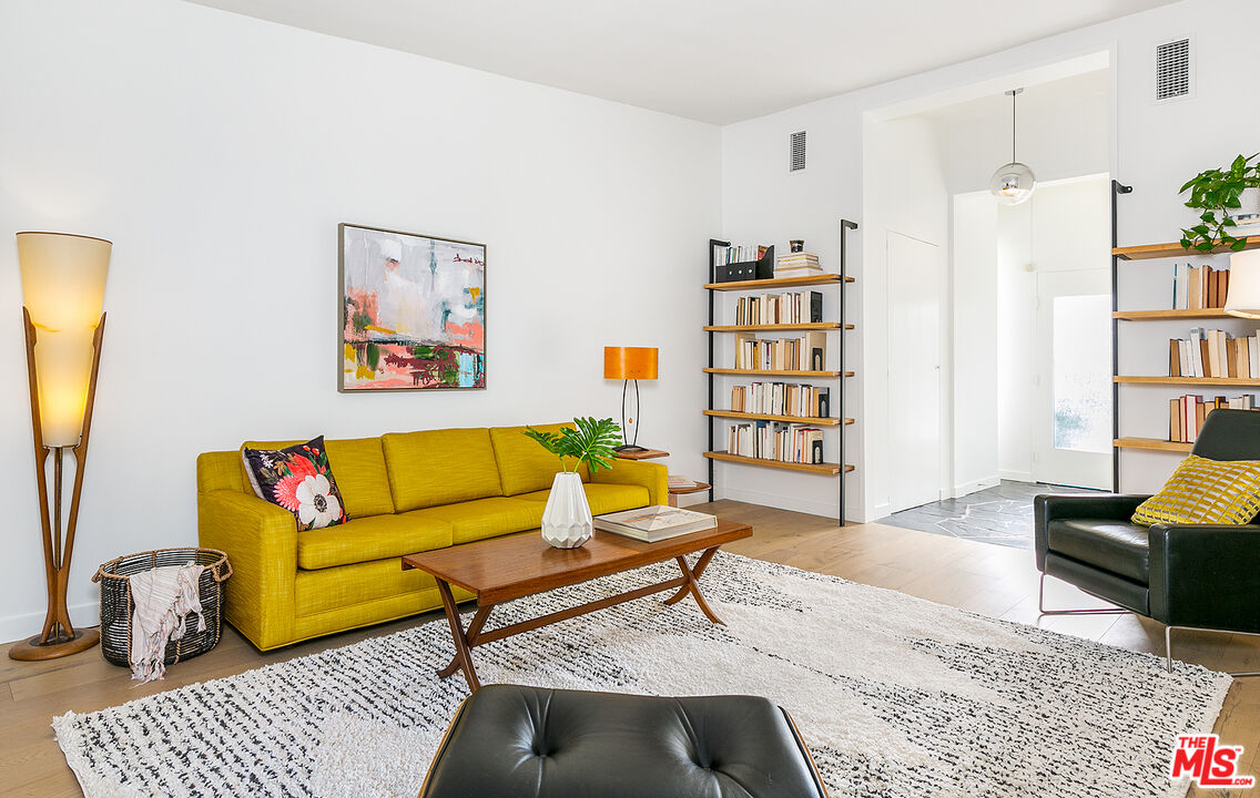 2386 Allen Avenue Altadena, CA 91001 - Photo 7 of 41 a living room with furniture and a book shelf