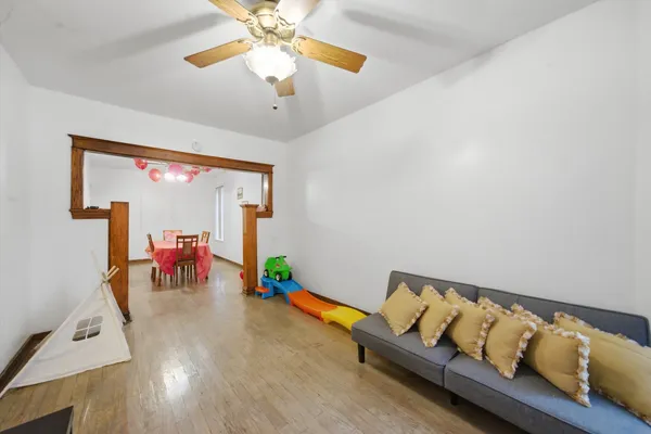 a bedroom with furniture and a flat screen tv