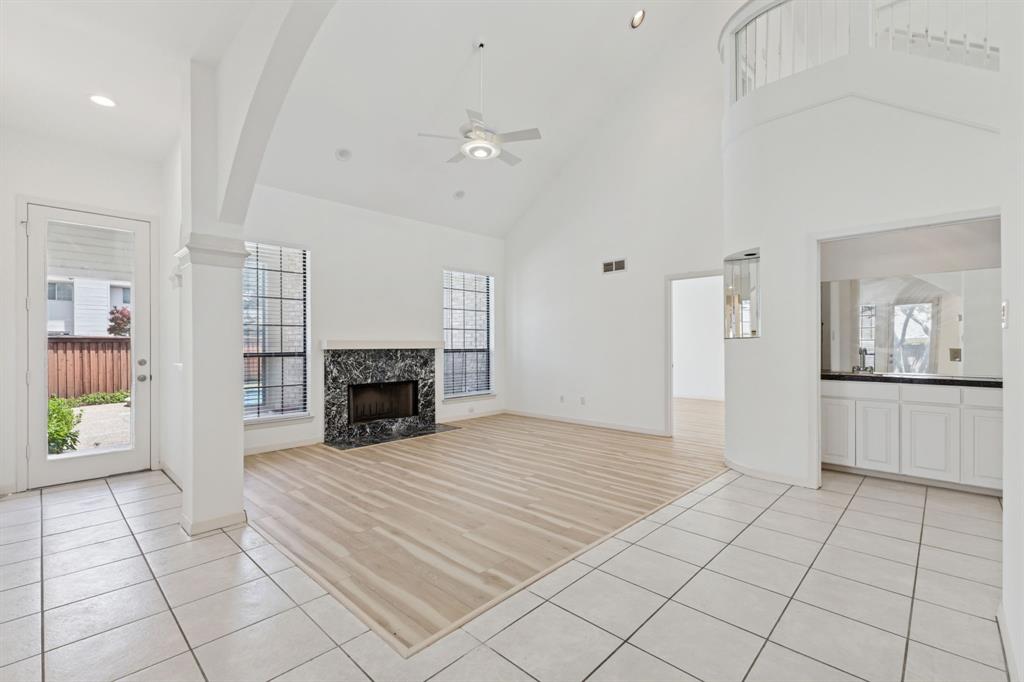 2685 Carnation Drive Richardson, TX 75082 - Photo 11 of 40 a view of an empty room with a fireplace and a window