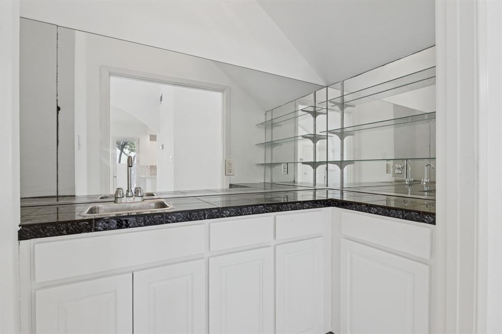 2685 Carnation Drive Richardson, TX 75082 - Photo 15 of 40 a bathroom with a sink and a mirror