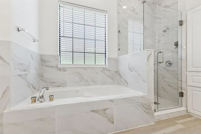a spacious bathroom with a double vanity sink mirror and