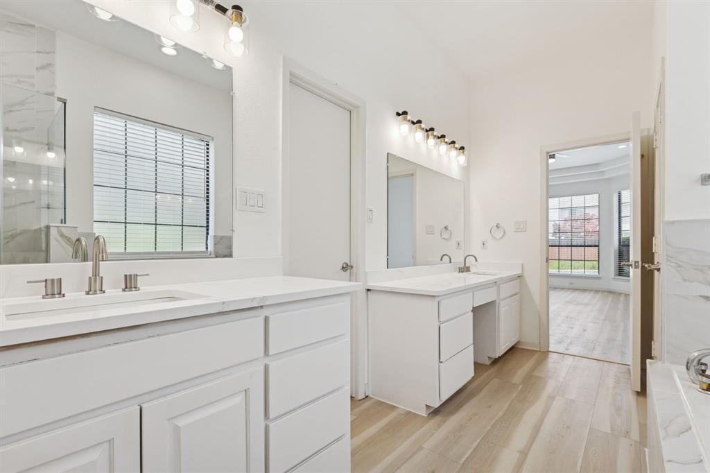 2685 Carnation Drive Richardson, TX 75082 - Photo 24 of 40 a spacious bathroom with a double vanity sink mirror and