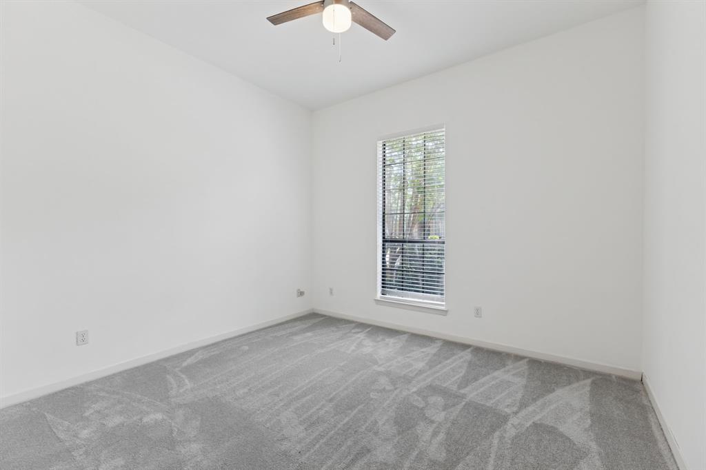 2685 Carnation Drive Richardson, TX 75082 - Photo 25 of 40 an empty room with windows and fan