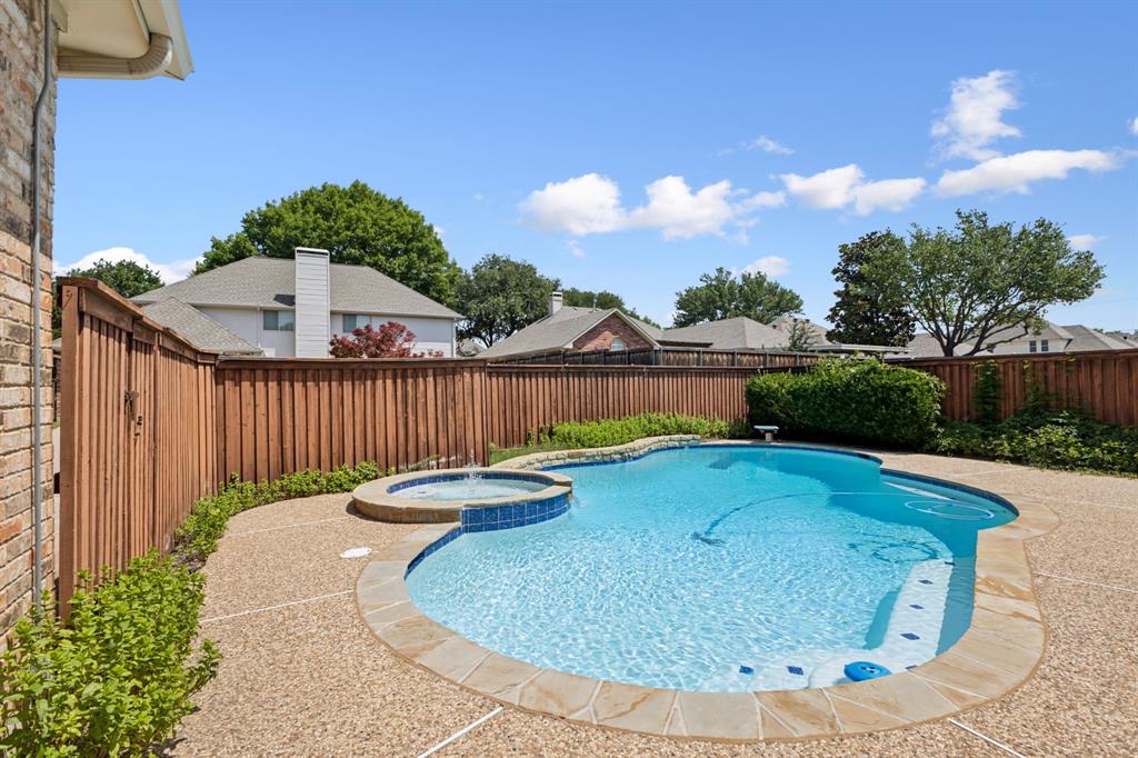 2685 Carnation Drive Richardson, TX 75082 - Photo 37 of 40 a view of a swimming pool with a yard