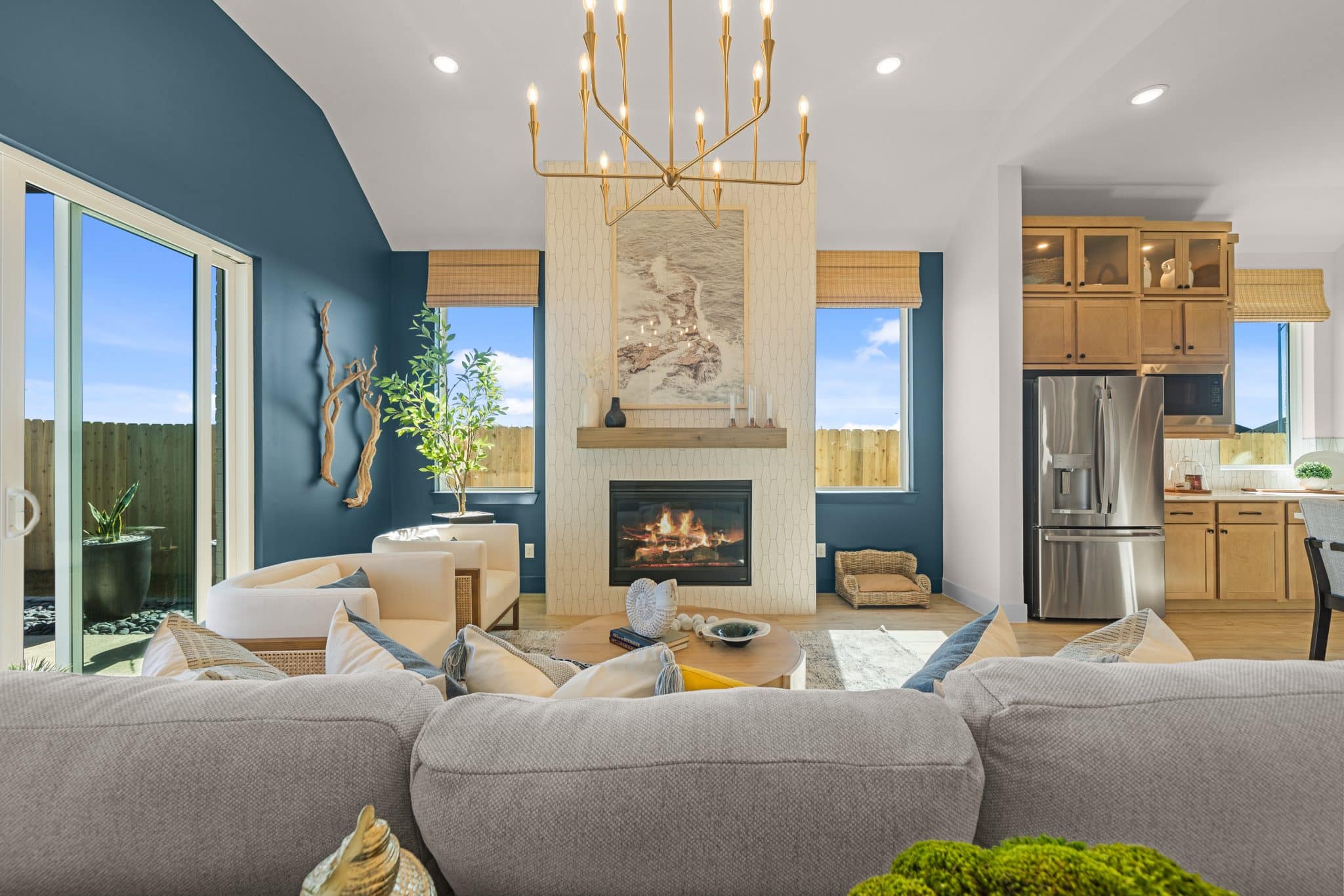 205 Purple Muhly Road Georgetown, TX 78633 - Photo 16 of 23 a living room with furniture a fireplace and a chandelier