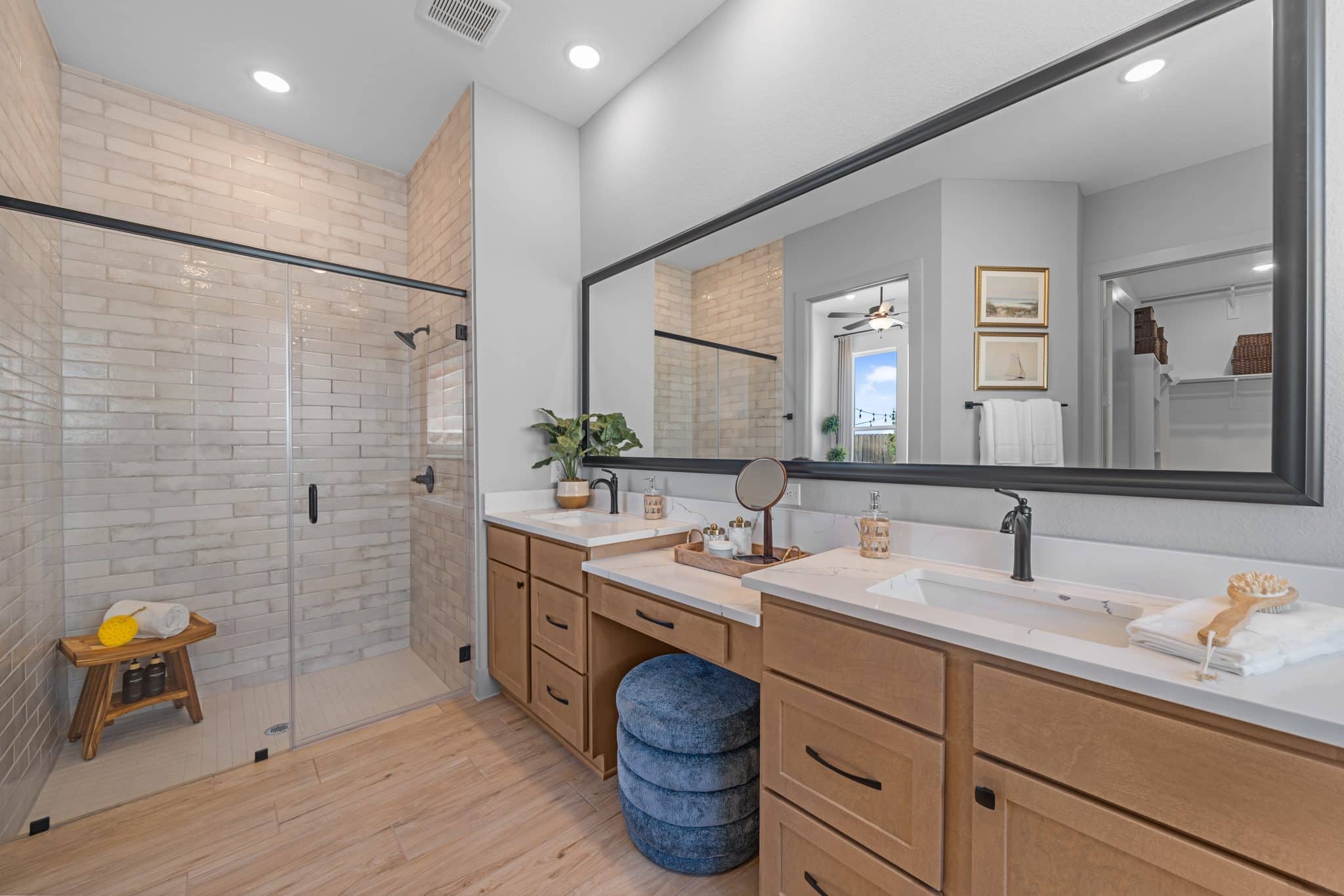 205 Purple Muhly Road Georgetown, TX 78633 - Photo 20 of 23 a bathroom with a double vanity sink mirror and