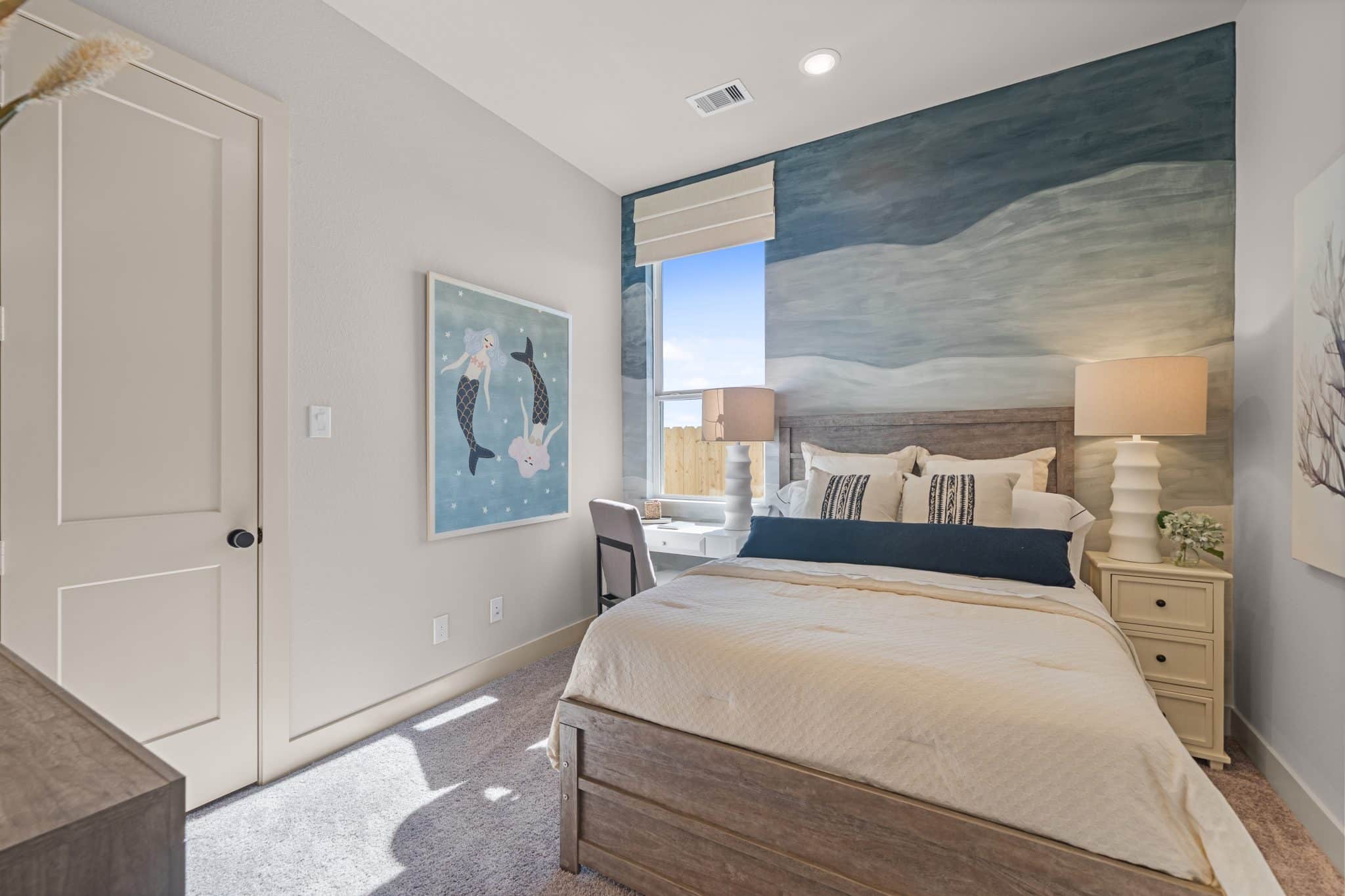 205 Purple Muhly Road Georgetown, TX 78633 - Photo 3 of 23 a bedroom with a large bed and a painting on the wall