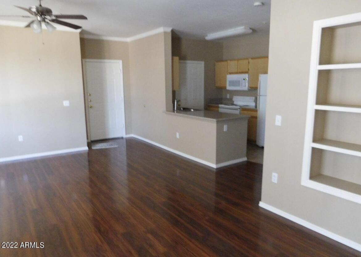 5345 East Van Buren Street, Unit 238 Phoenix, AZ 85008 - Photo 12 of 25 a view of a kitchen from the hallway with a sink