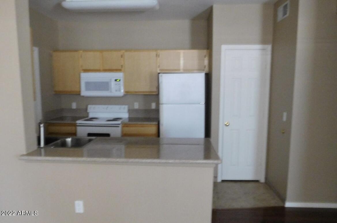 5345 East Van Buren Street, Unit 238 Phoenix, AZ 85008 - Photo 13 of 25 a utility room with dryer and washer
