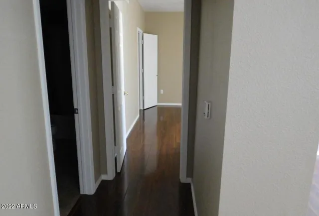 a view of a hallway with a door