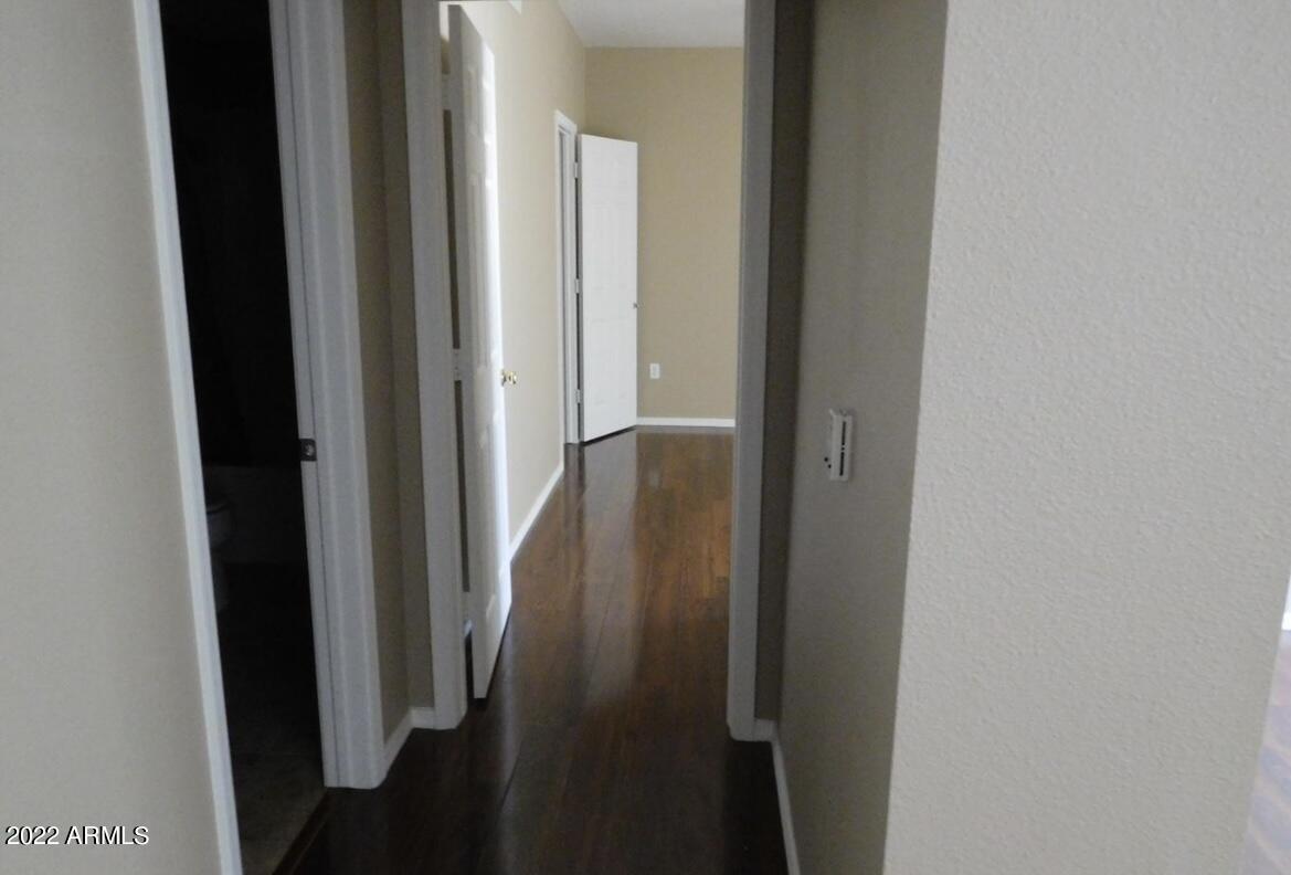 5345 East Van Buren Street, Unit 238 Phoenix, AZ 85008 - Photo 16 of 25 a view of a hallway with a door
