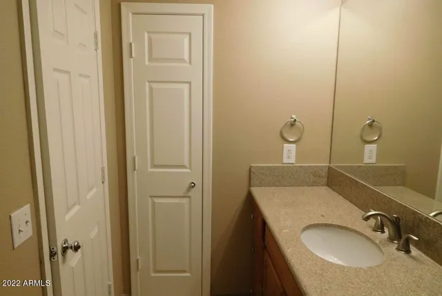 a bathroom with a sink and mirror