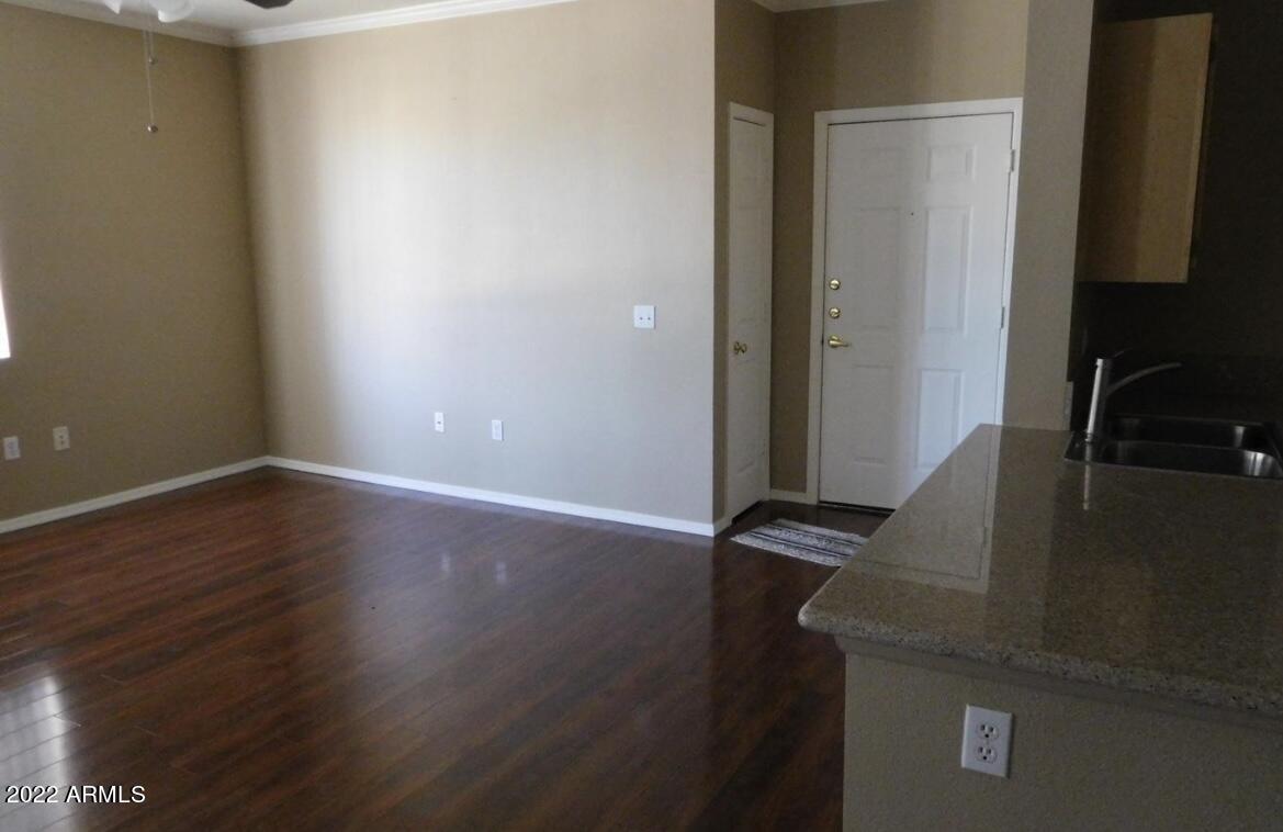 5345 East Van Buren Street, Unit 238 Phoenix, AZ 85008 - Photo 22 of 25 a view of a hallway with wooden floor