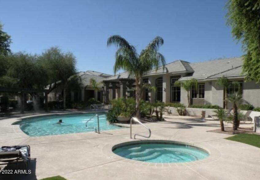 5345 East Van Buren Street, Unit 238 Phoenix, AZ 85008 - Photo 4 of 25 a front view of a house with garden