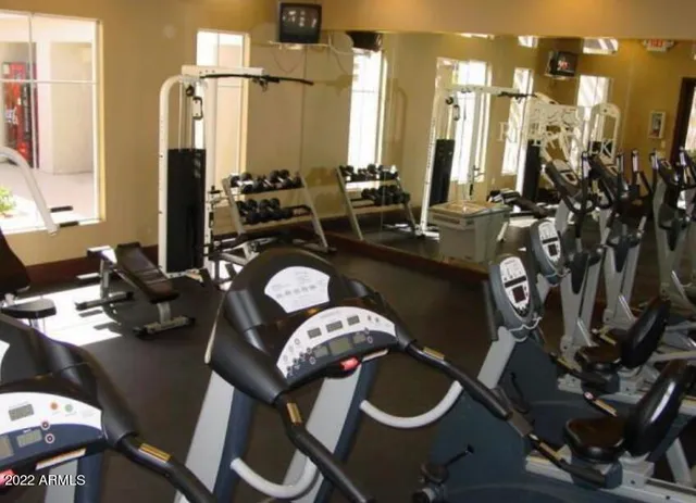 a bathroom with a sink mirror and vanity