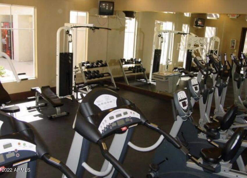 5345 East Van Buren Street, Unit 238 Phoenix, AZ 85008 - Photo 6 of 25 a bathroom with a sink mirror and vanity