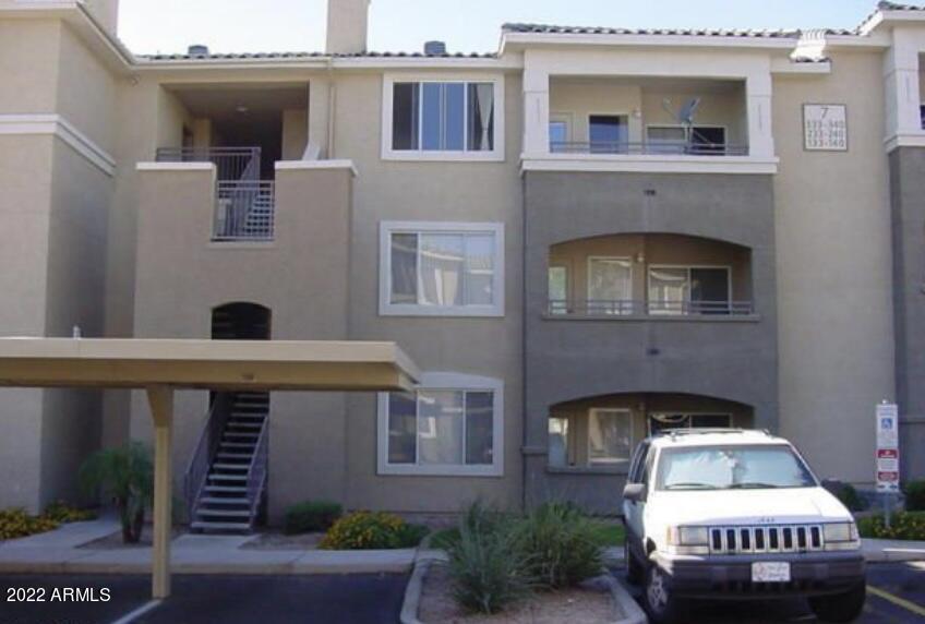 5345 East Van Buren Street, Unit 238 Phoenix, AZ 85008 - Photo 7 of 25 a front view of a house with a yard