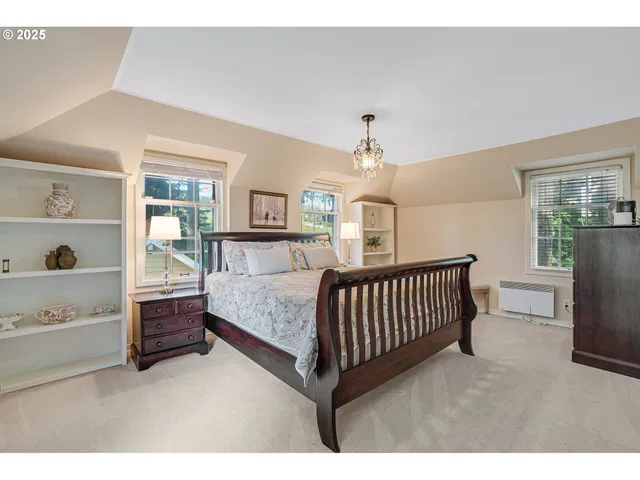 a bedroom with furniture and a window