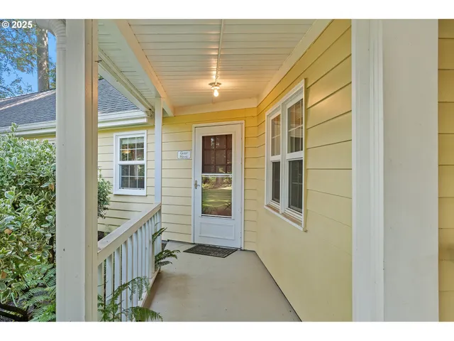 a view of an entryway with wooden floor and door
