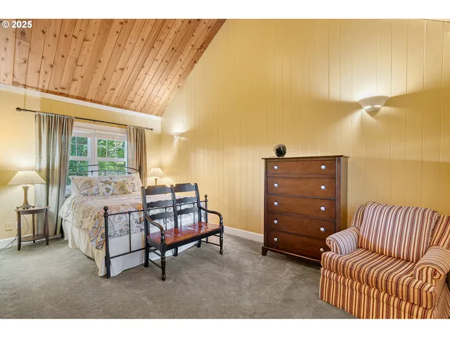 a living room with furniture and a balcony