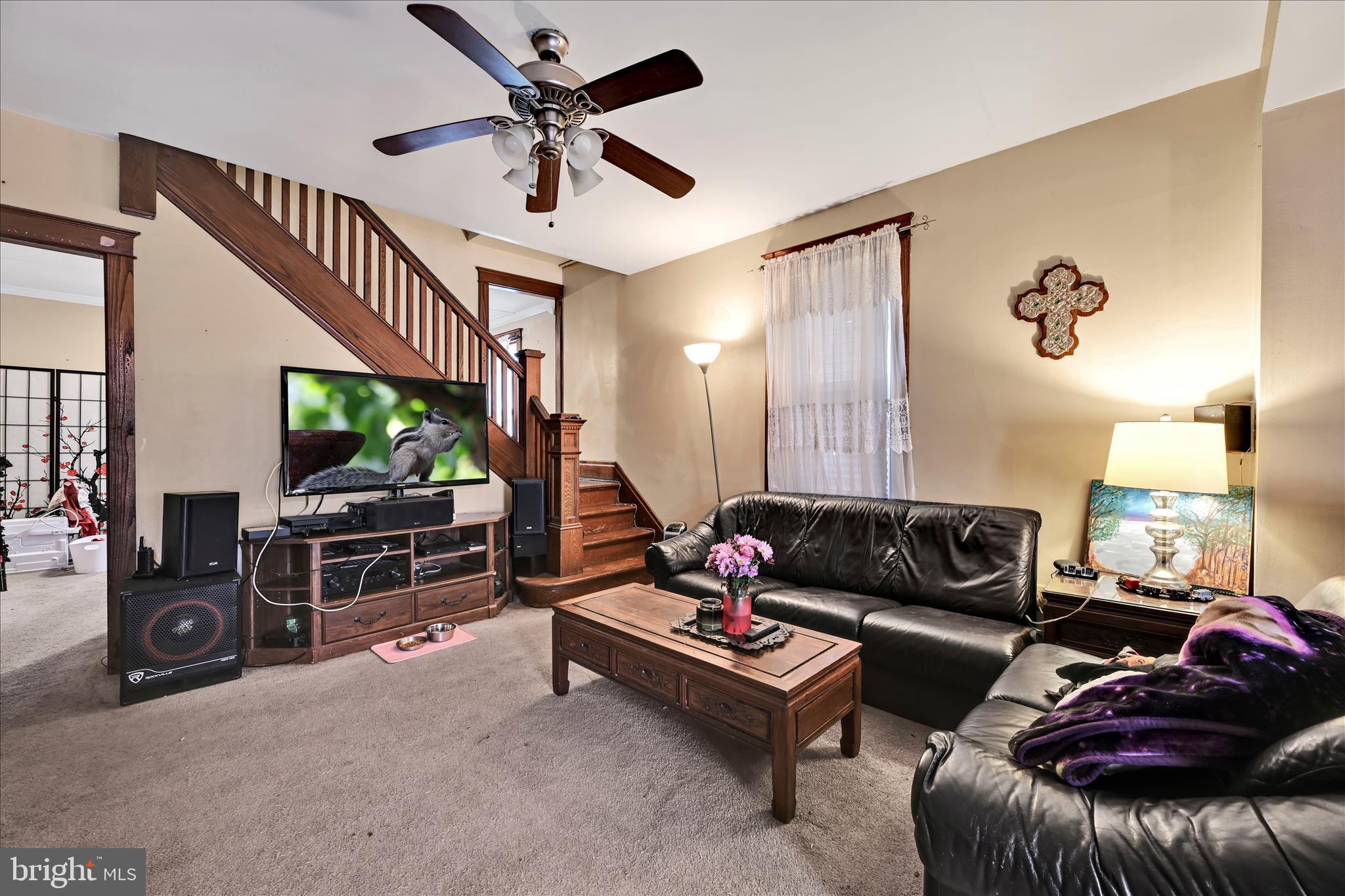 544 Spruce Street Steelton, PA 17113 - Photo 12 of 33 a living room with furniture and a flat screen tv